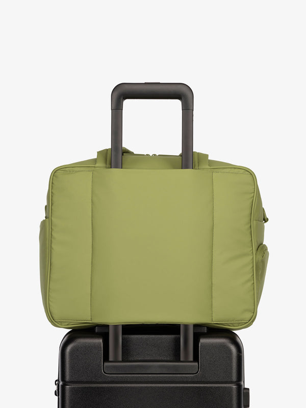 CALPAK Luka Duffel bag with luggage trolley sleeve in pistachio green