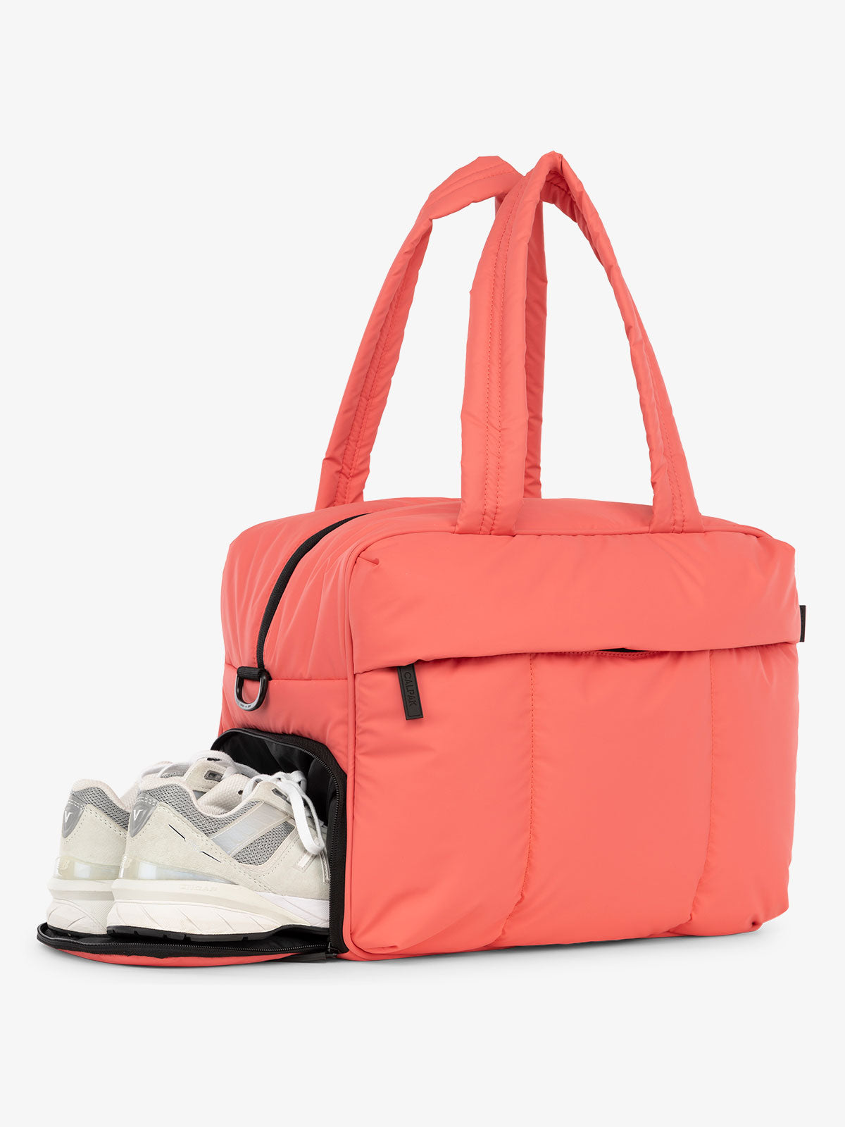 CALPAK Luka Duffel Bag with side shoe compartment and top handles in light watermelon pink