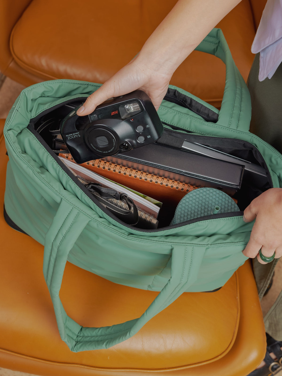 CALPAK Luka expandable laptop bag with multiple compartments in green;  ALT2201-SAGE