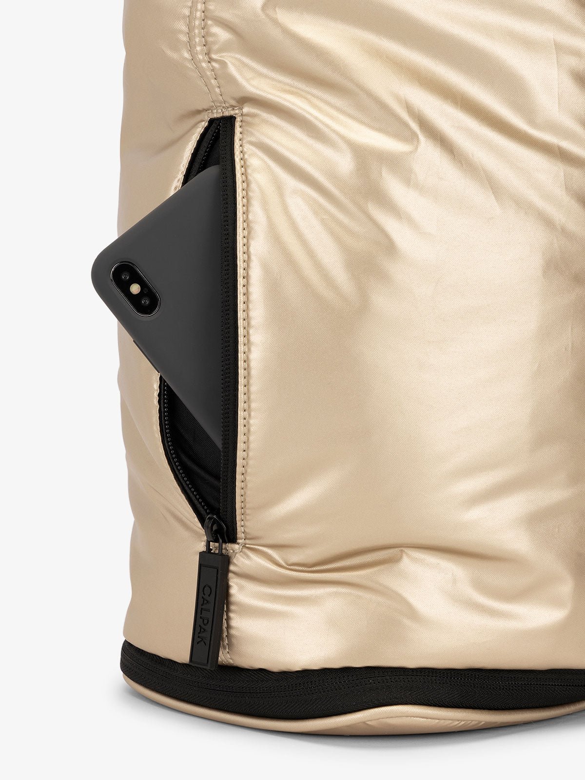 CALPAK Luka expandable laptop bag with hidden zippered pockets in metallic gold