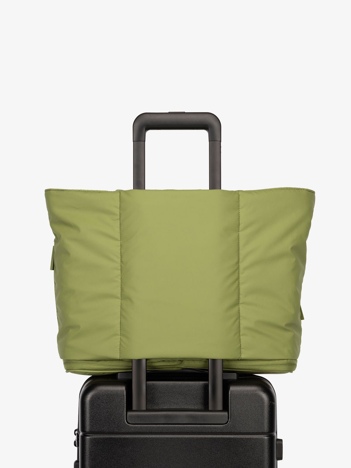 CALPAK Luka expandable travel bag with laptop compartment and trolley sleeve in pistachio green