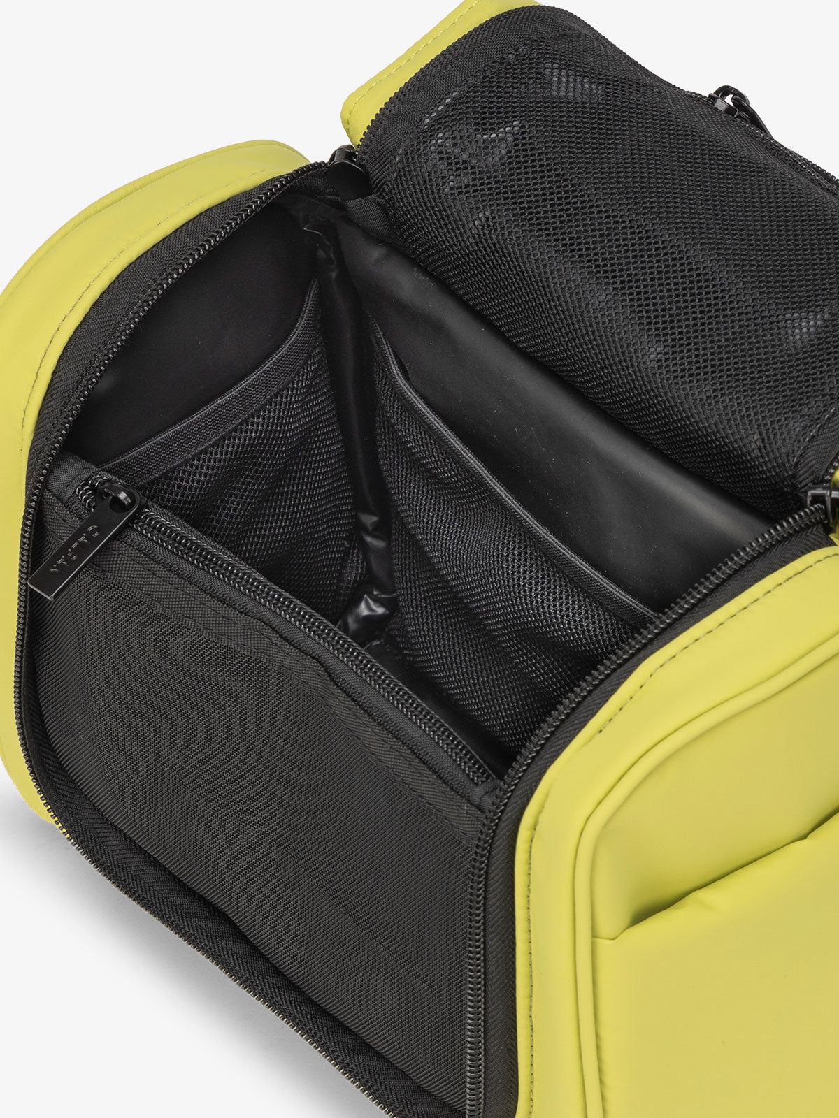 CALPAK Luka Hanging Toiletry Bag with water-resistant lining and mesh pockets for toiletries and makeup in green celery; TLH2301-CELERY