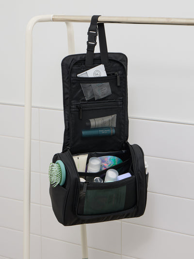 CALPAK Luka Hanging Toiletry Bag with carrying handle in matte black; TLH2301-MATTE-BLACK