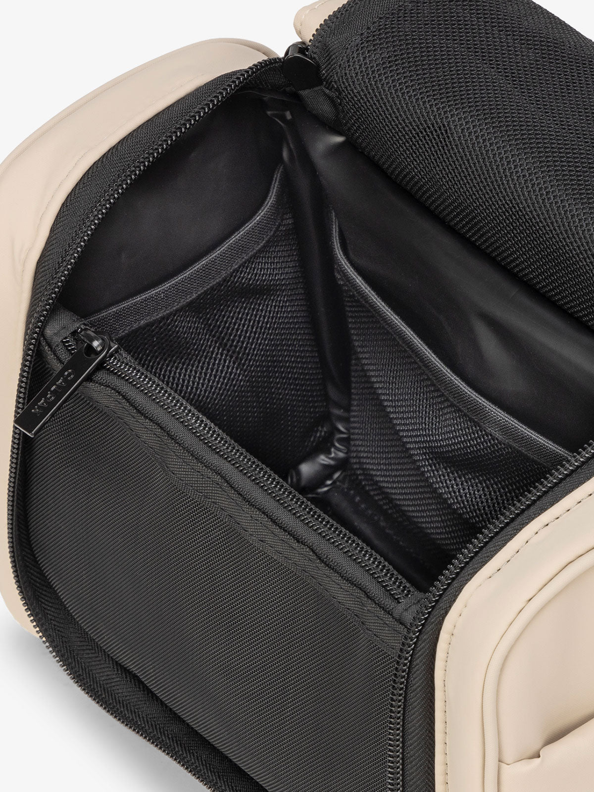 CALPAK Luka Hanging Toiletry Bag with water-resistant lining and mesh pockets for toiletries and makeup in oatmeal; TLH2301-OATMEAL