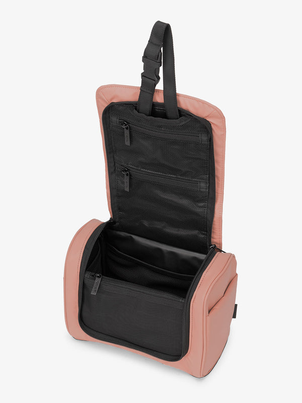 Luka Hanging Toiletry Bag with multiple interior pockets and retractable hanging strap in pink