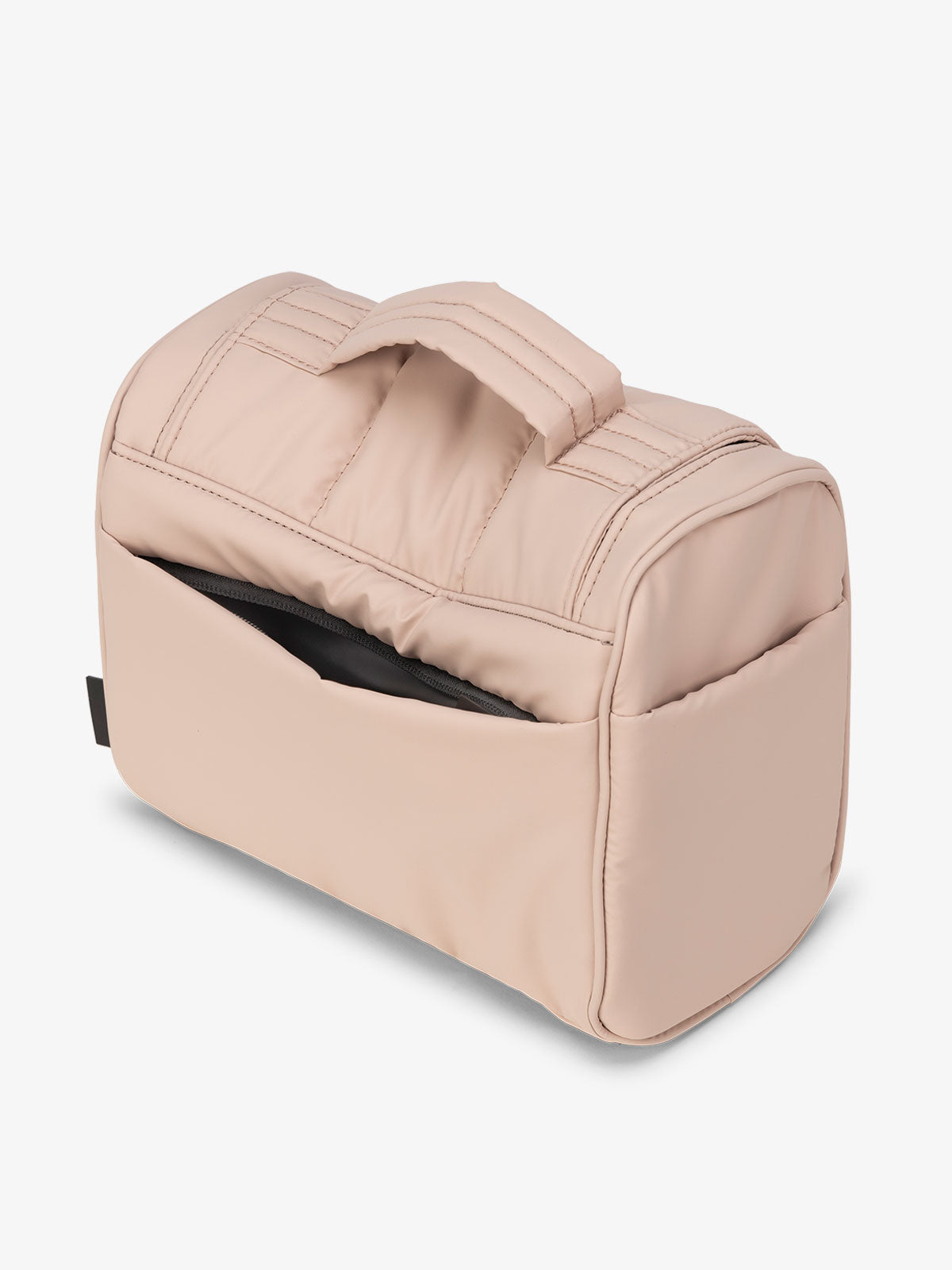 Light pink CALPAK Luka Hanging Toiletry Bag featuring additional secure zippered back pocket; TLH2301-ROSE-QUARTZ