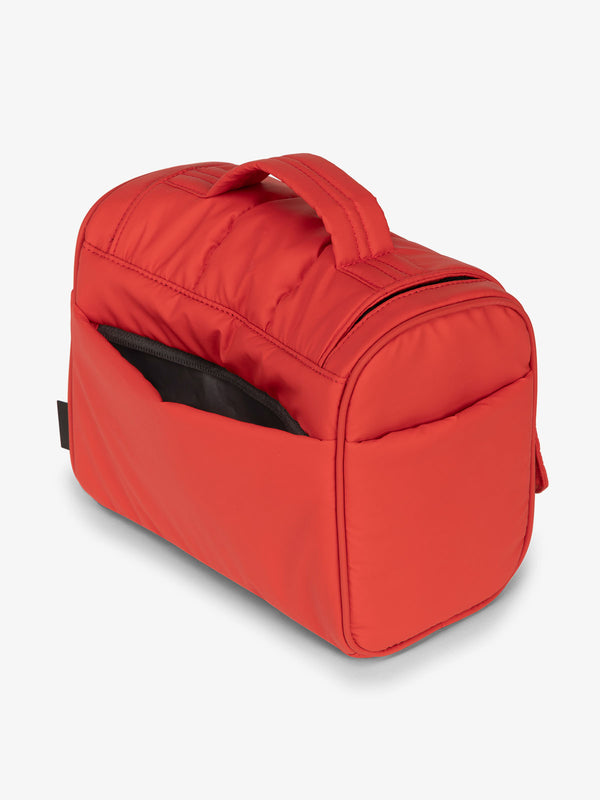Red rouge CALPAK Luka Hanging Toiletry Bag featuring additional secure zippered back pocket