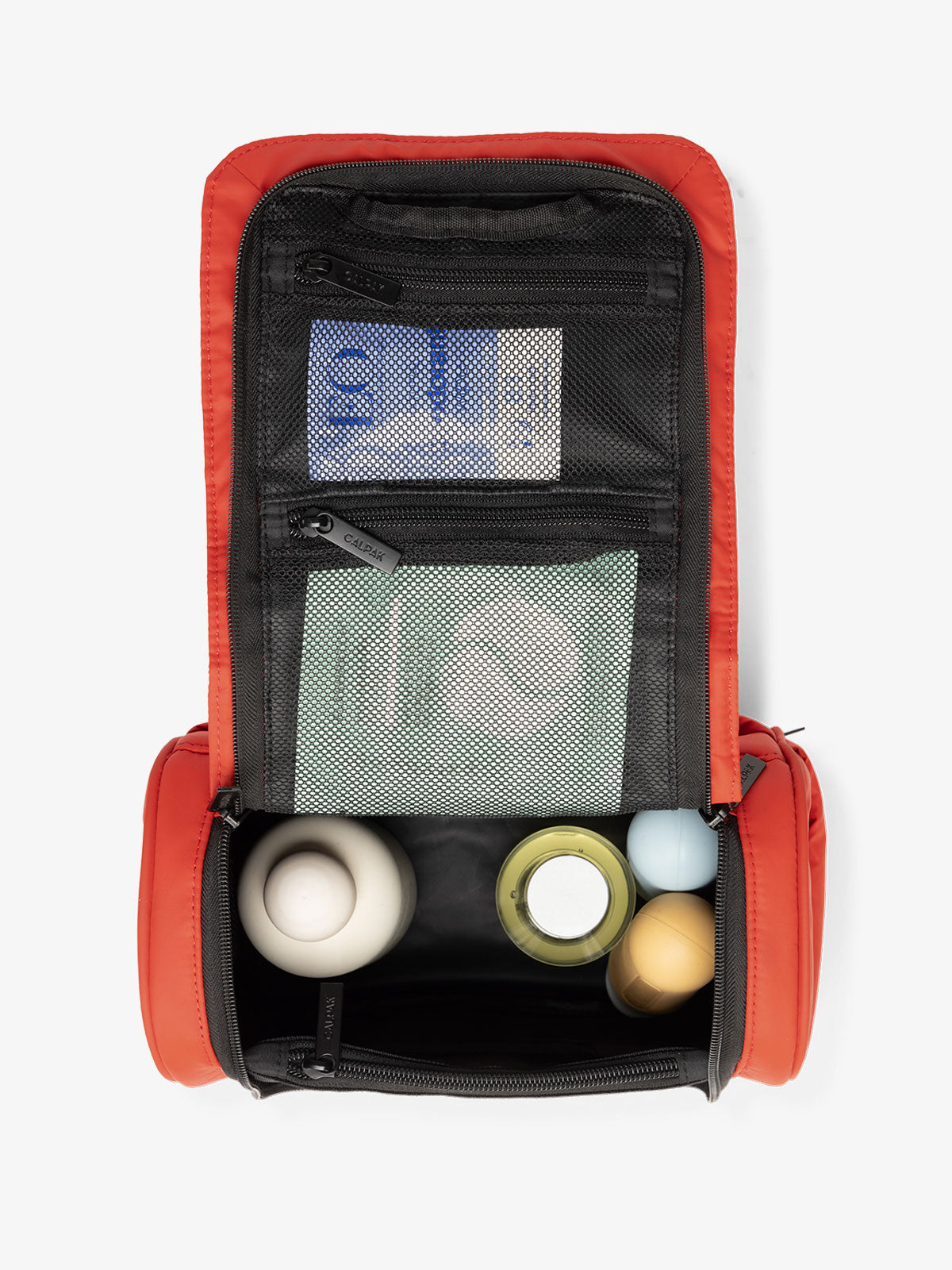 CALPAK luka hanging toiletry bag with multiple interior and exterior pockets and compartments in red; TLH2301-ROUGE