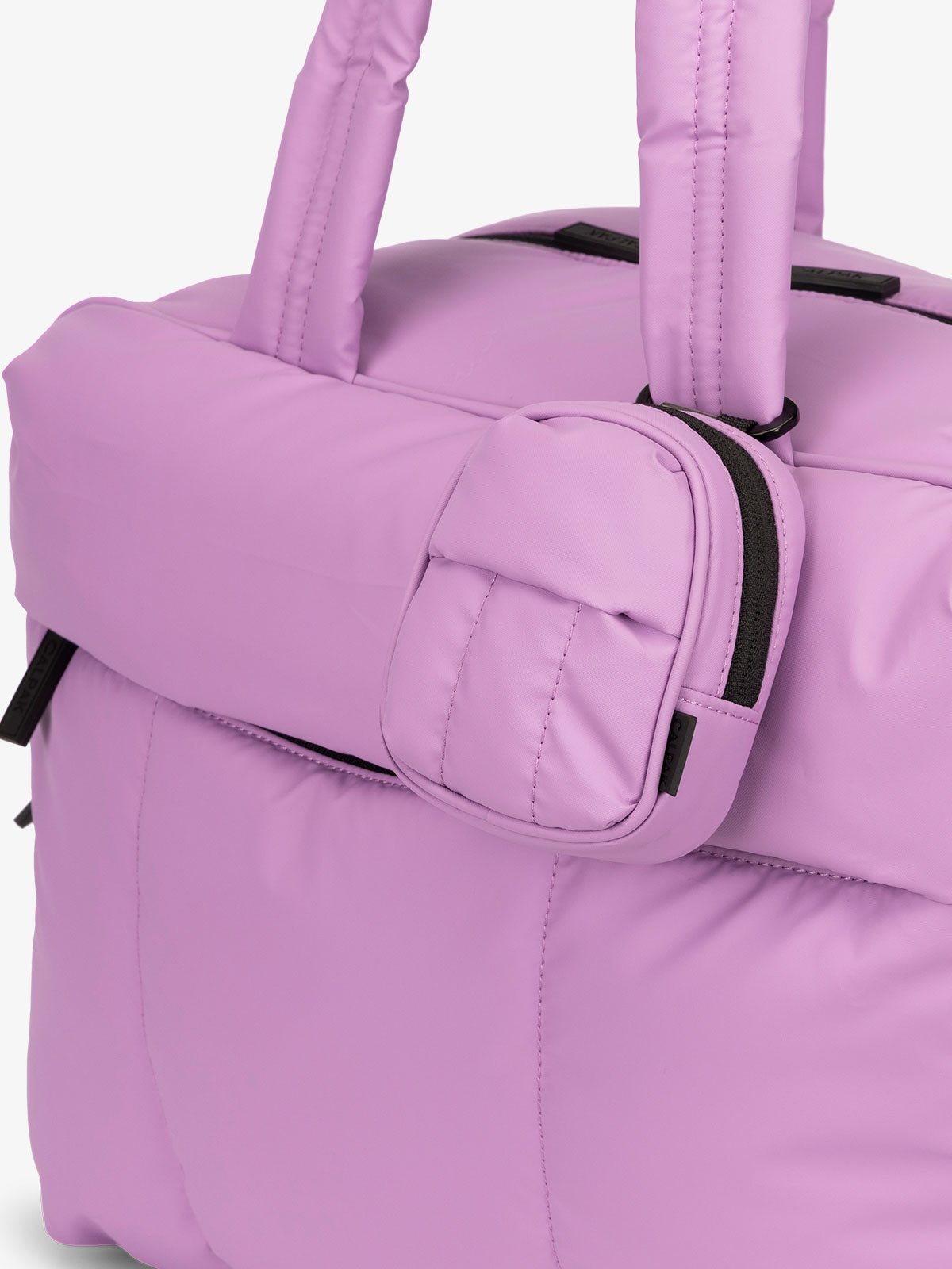 CALPAK Luka mini backpack keychain attached to duffel with carabiner clip in lilac lavender