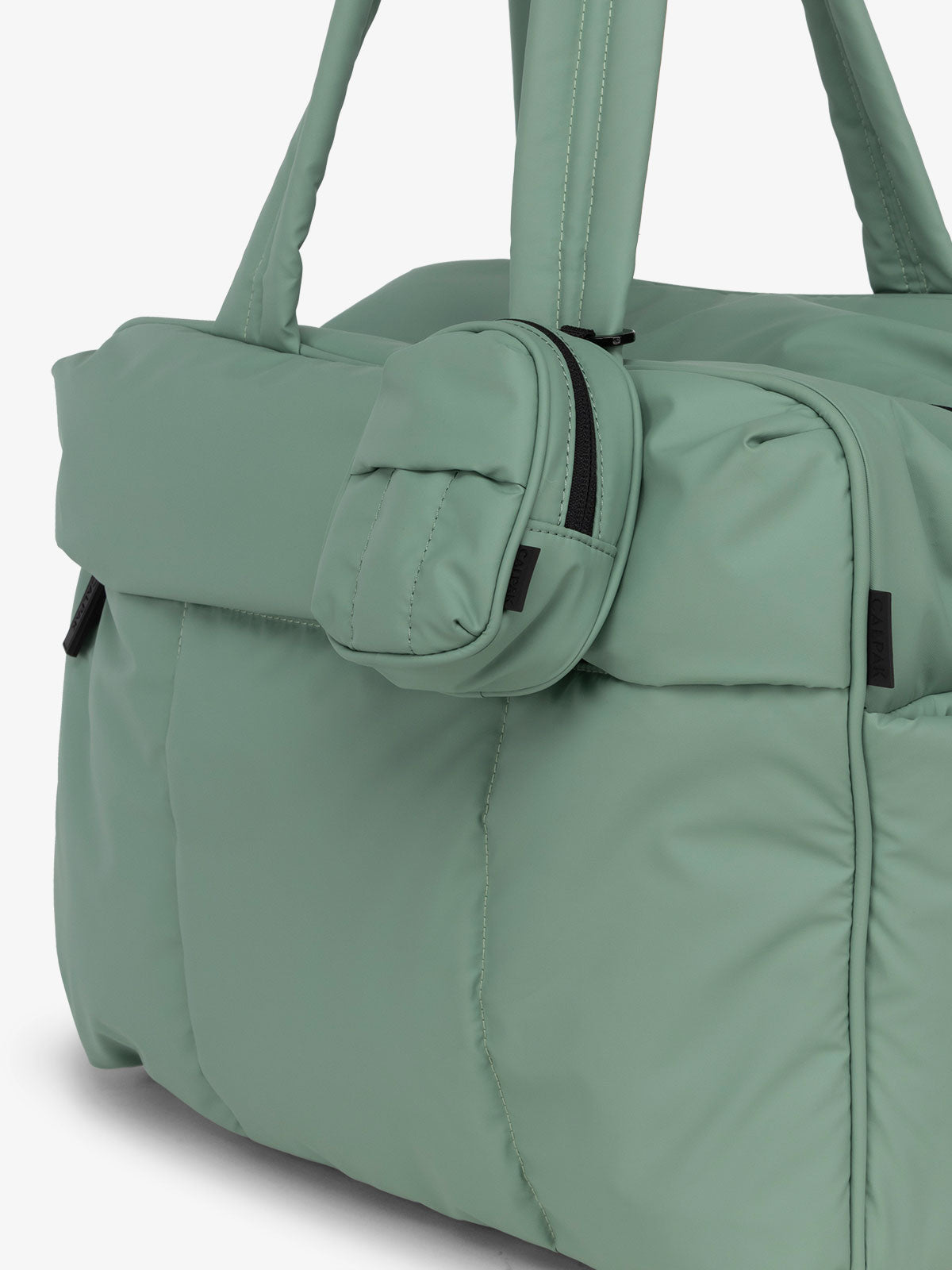 CALPAK Luka backpack key chain with back versatile elastic wrist strap and carabiner clip in matte sage green; AMB2201-SAGE
