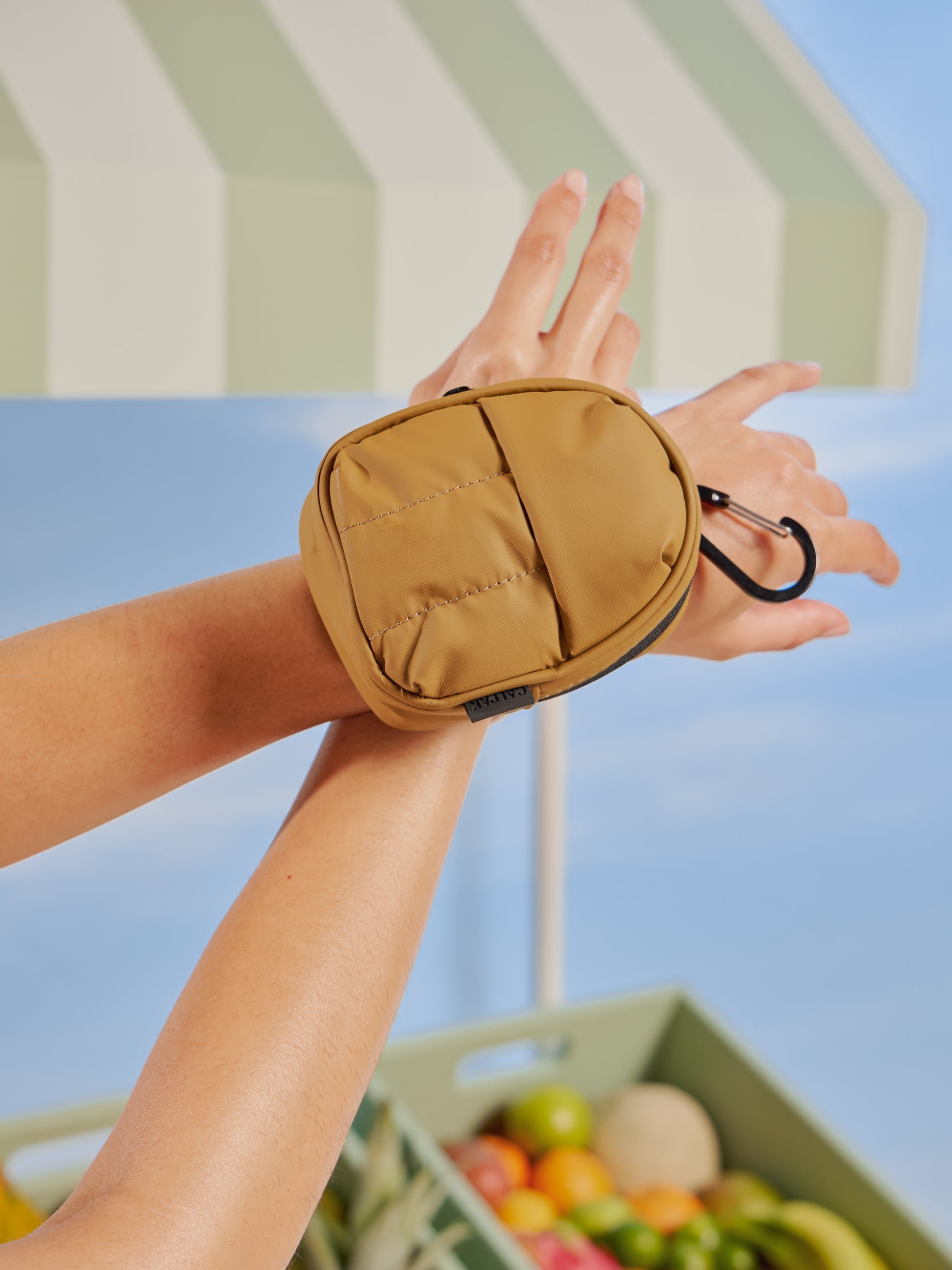 CALPAK Luka backpack key chain with back versatile elastic wrist strap in brown