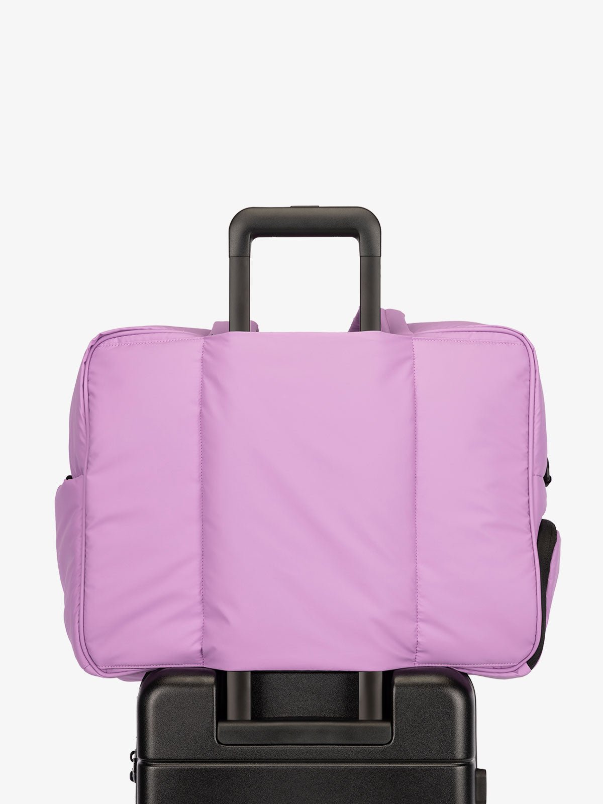 CALPAK Luka large travel duffel bag with trolley sleeve for luggage in lilac