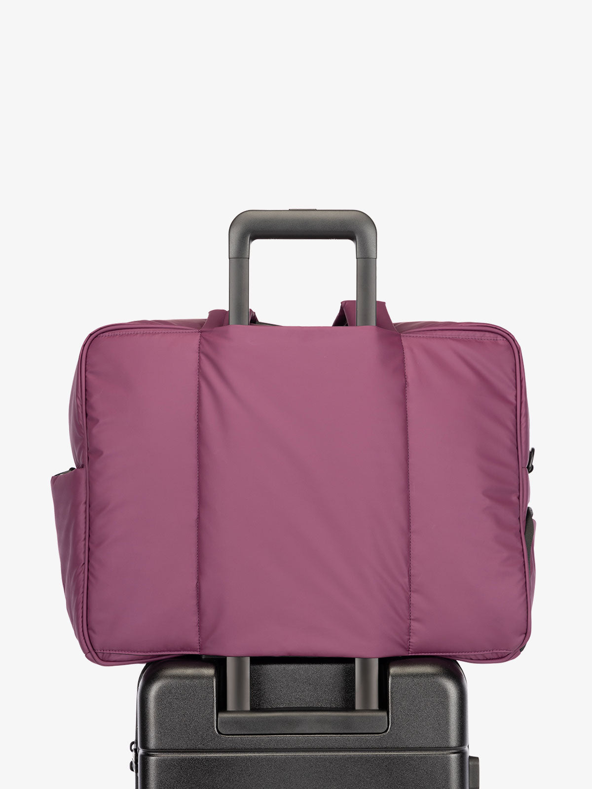 CALPAK Luka large travel duffel bag with trolley sleeve for luggage in purple plum; DLL2201-PLUM
