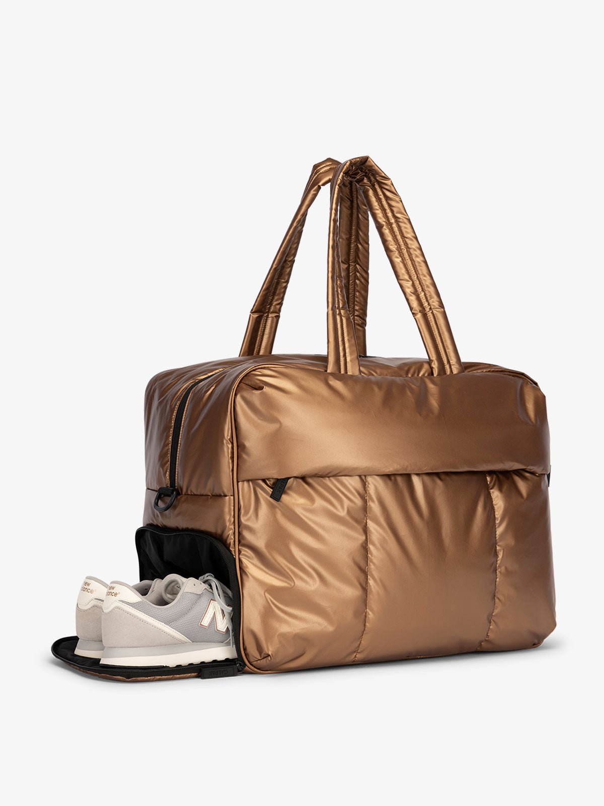 CALPAK Luka large duffel bag with side shoe compartment and dual handles in copper