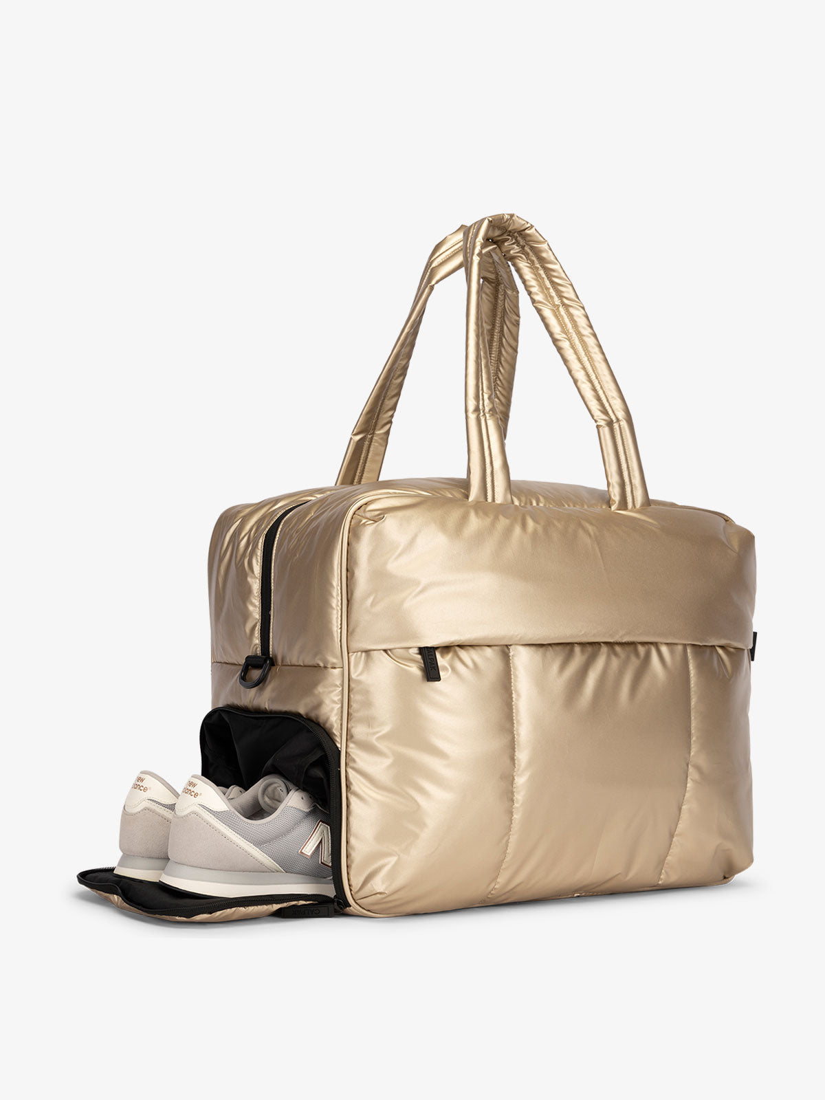 CALPAK Luka large duffel bag with side shoe compartment and dual handles in metallic gold; DLL2201-GOLD