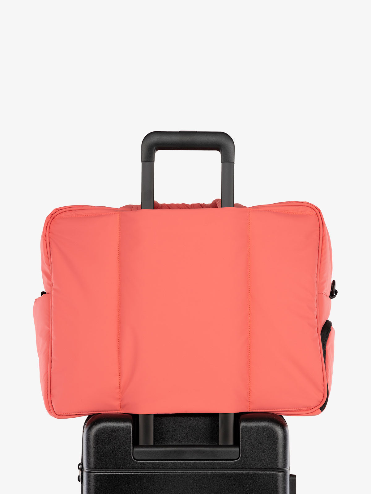 CALPAK Luka large travel duffel bag with trolley sleeve for luggage in pink; DLL2201-WATERMELON