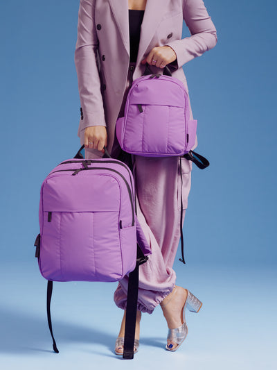 CALPAK Luka Mini Backpack with soft puffy exterior and front zippered pocket in light purple lilac; BPM2201-LILAC