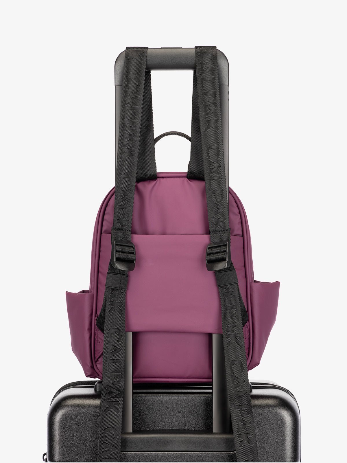CALPAK Luka small travel Backpack with luggage sleeve and adjustable straps in purple plum