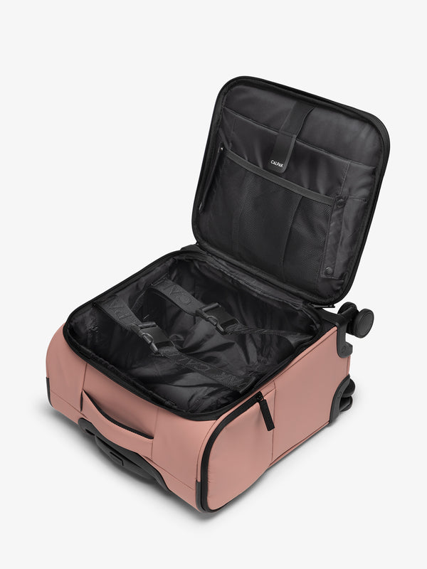 CALPAK Luka mini soft sided carry-on suitcase with laptop compartment and multiple interior pockets in peony pink