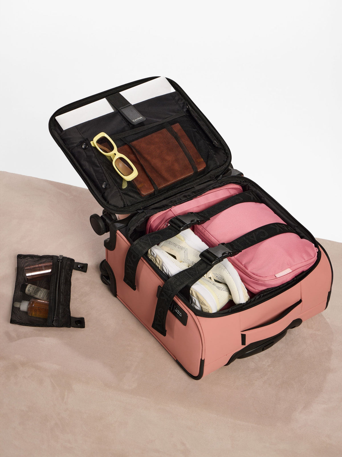 Peony CALPAK Luka Soft-Sided Mini Carry-On Luggage with belongings inside; LSM1014-PEONY