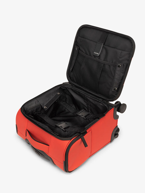 CALPAK Luka mini soft sided carry-on suitcase with laptop compartment and multiple interior pockets in rouge