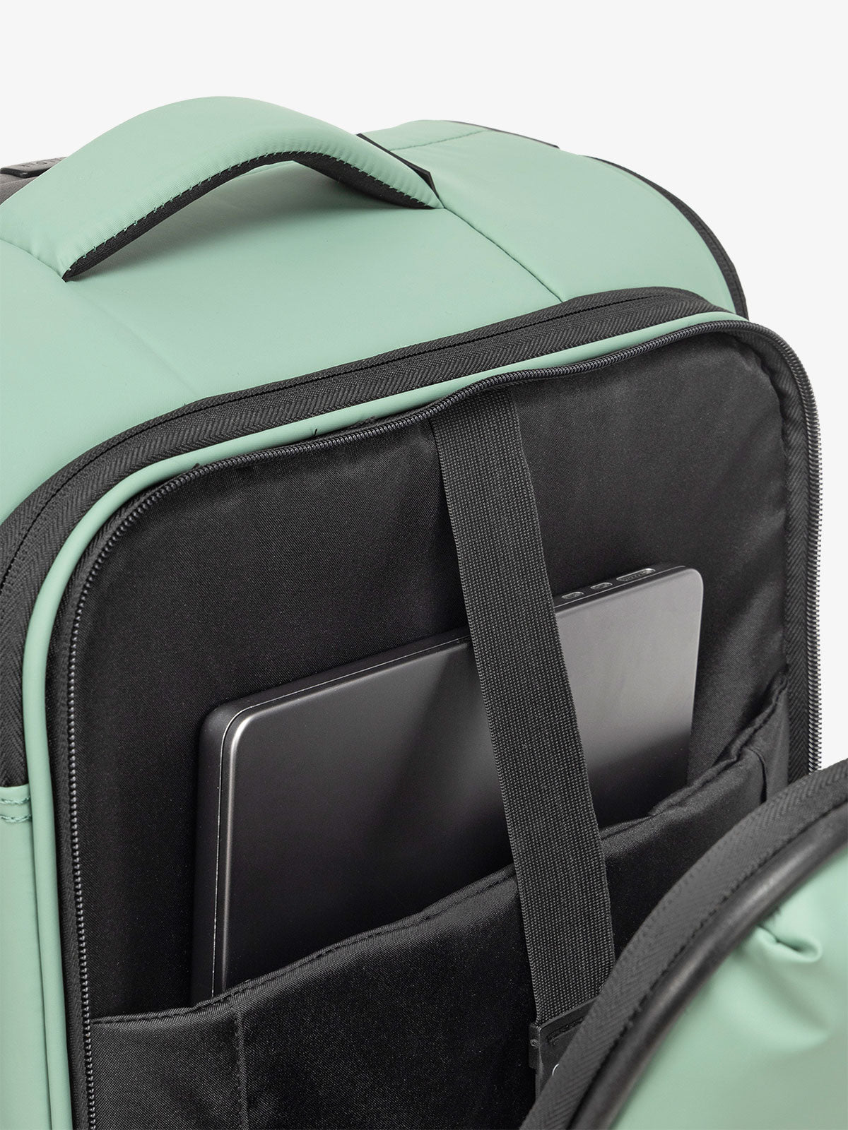 CALPAK Luka soft sided carry on luggage with top handle and padded laptop compartment in sage; LSM1020-SAGE