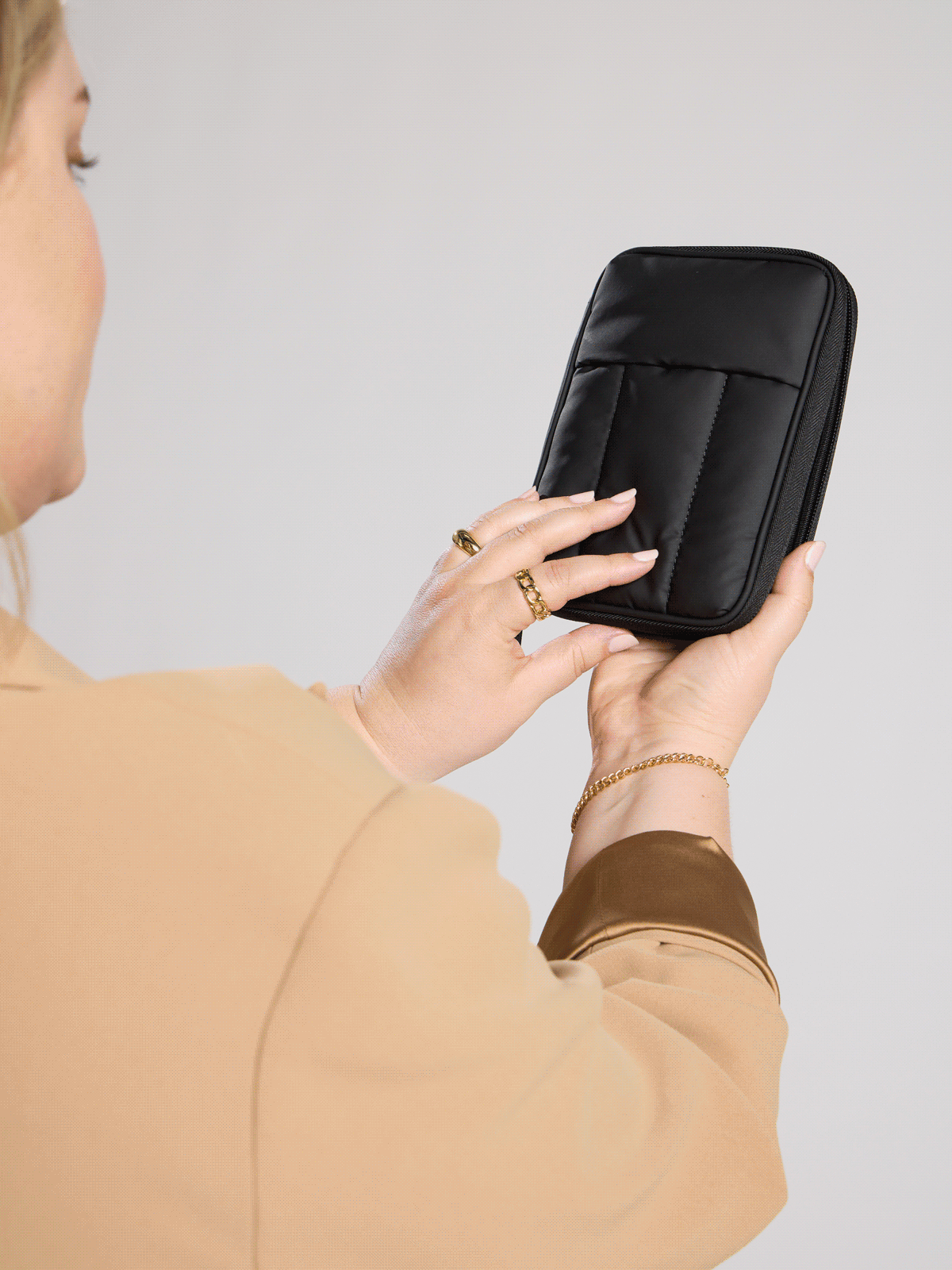 Black CALPAK Luka Zippered Passport Wallet for organizing credit cards, passport, tickets, cash, and travel items