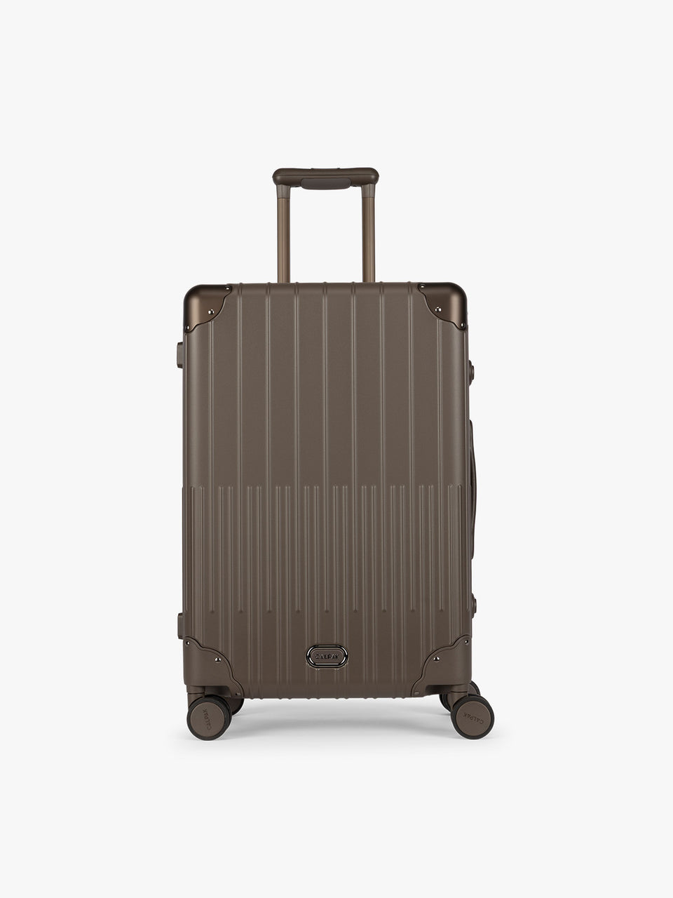 CALPAK Vault luggage brown Mushroom hard-shell spinner suitcase with a ribbed vertical design, shown from the front against a clean white background; LVT1024-MUSHROOM