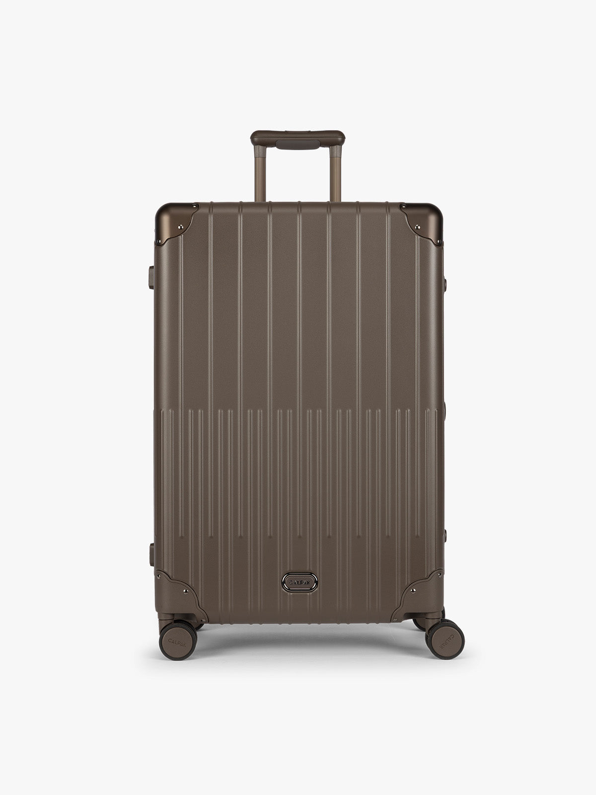 CALPAK Large Vault Luggage in brown Mushroom with hard-shell spinner suitcase with a ribbed vertical design, shown from the front on a light gray background; LVT1028-MUSHROOM