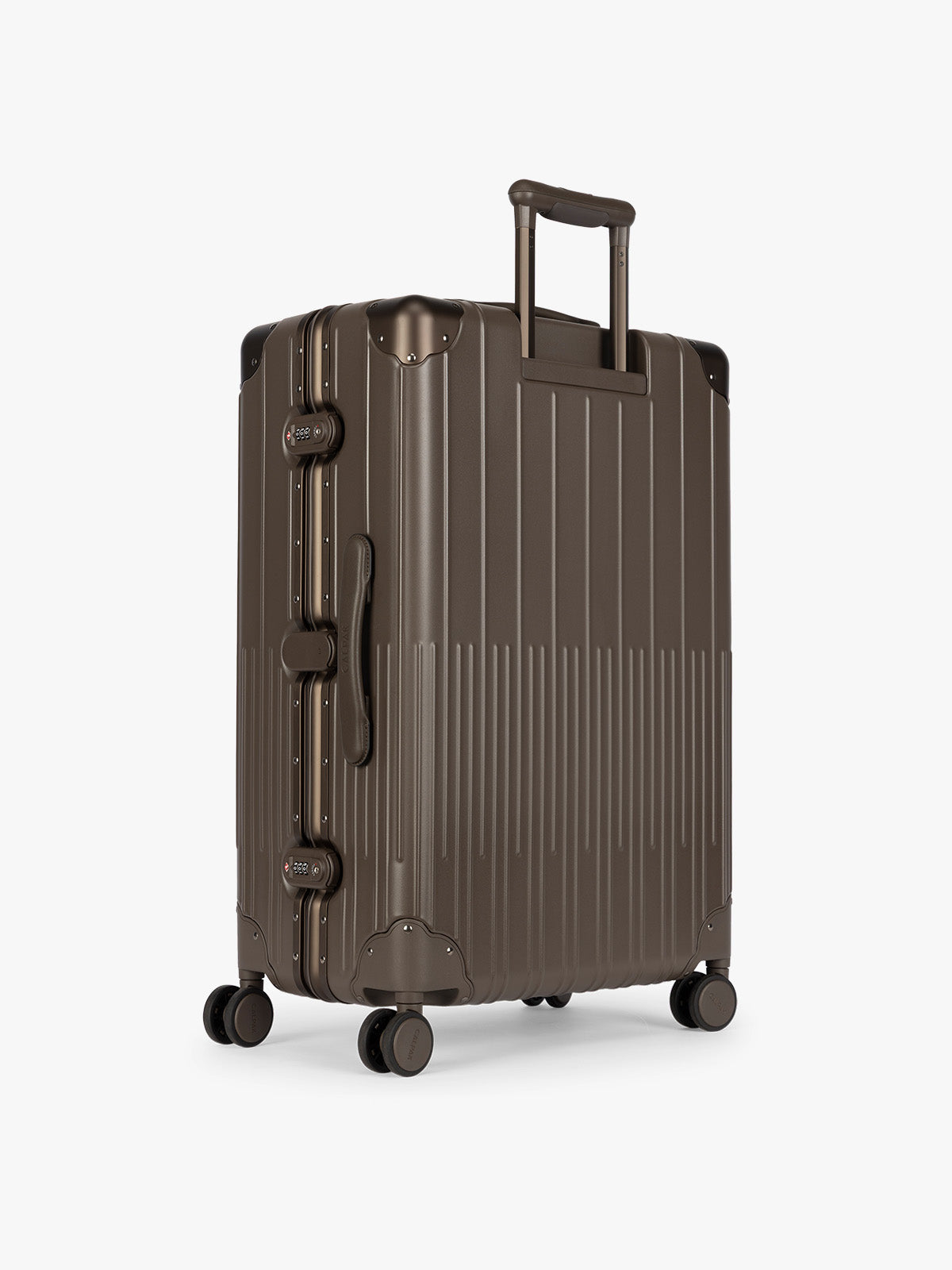 Backside of CALPAK Large Vault Luggage in brown Mushroom with hard-shell spinner suitcase with a ribbed vertical design, shown from the front on a light gray background; LVT1028-MUSHROOM