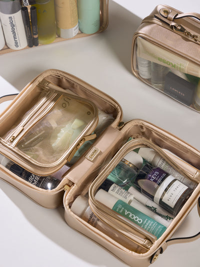 CALPAK Medium clear makeup bag with compartments in metallic gold; CMM2201-GOLD