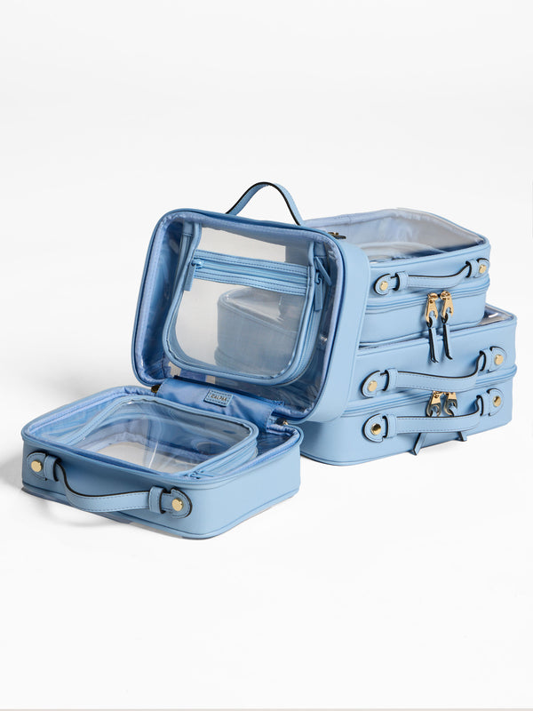 Blue CALPAK Clear Cosmetics Cases in small, medium and large