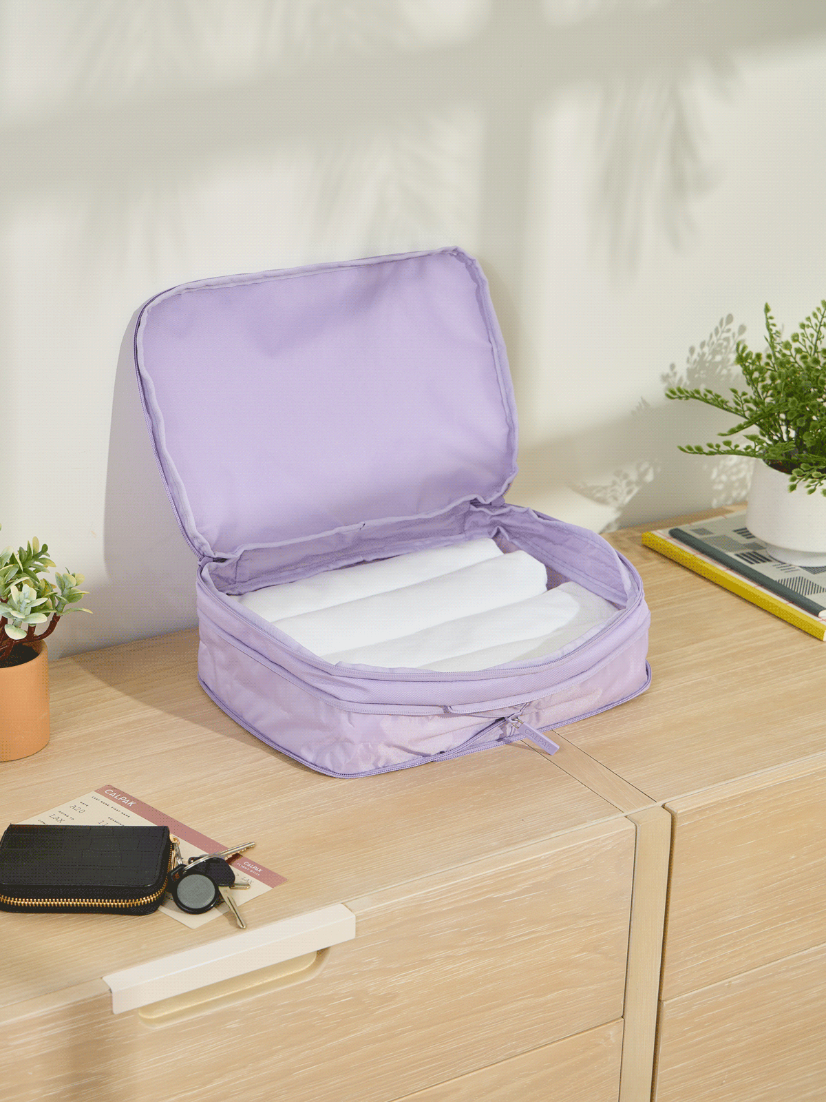 CALPAK Medium Compression Packing Cubes made of durable material and expandable by 4.5" in orchid