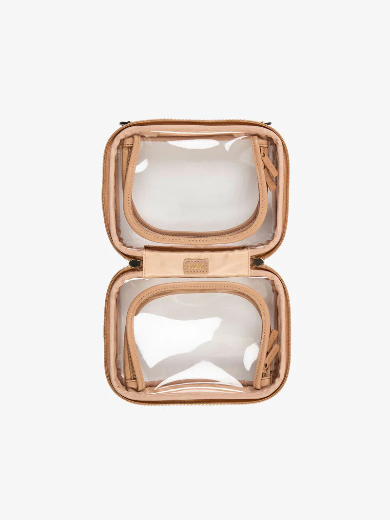 A top view of the CALPAK small clear cosmetics case in caramel opened to showcase the dual zippered compartments.