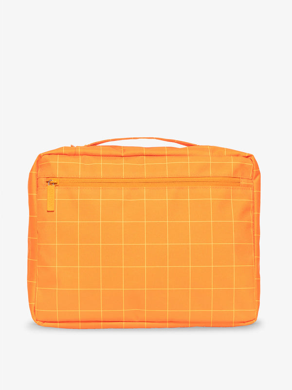 CALPAK zippered mesh organizers with top handle in orange grid