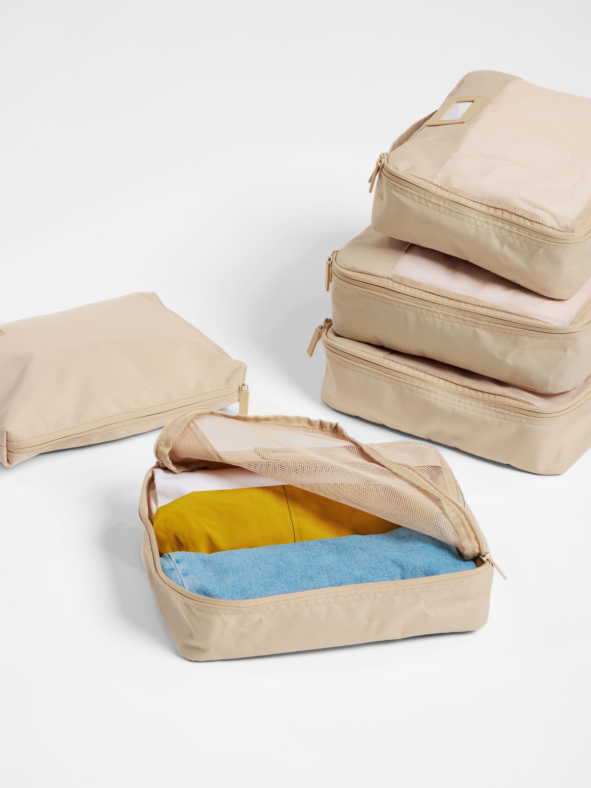 CALPAK Packing Cubes 5-Piece Set for organizing belongings in beige oatmeal
