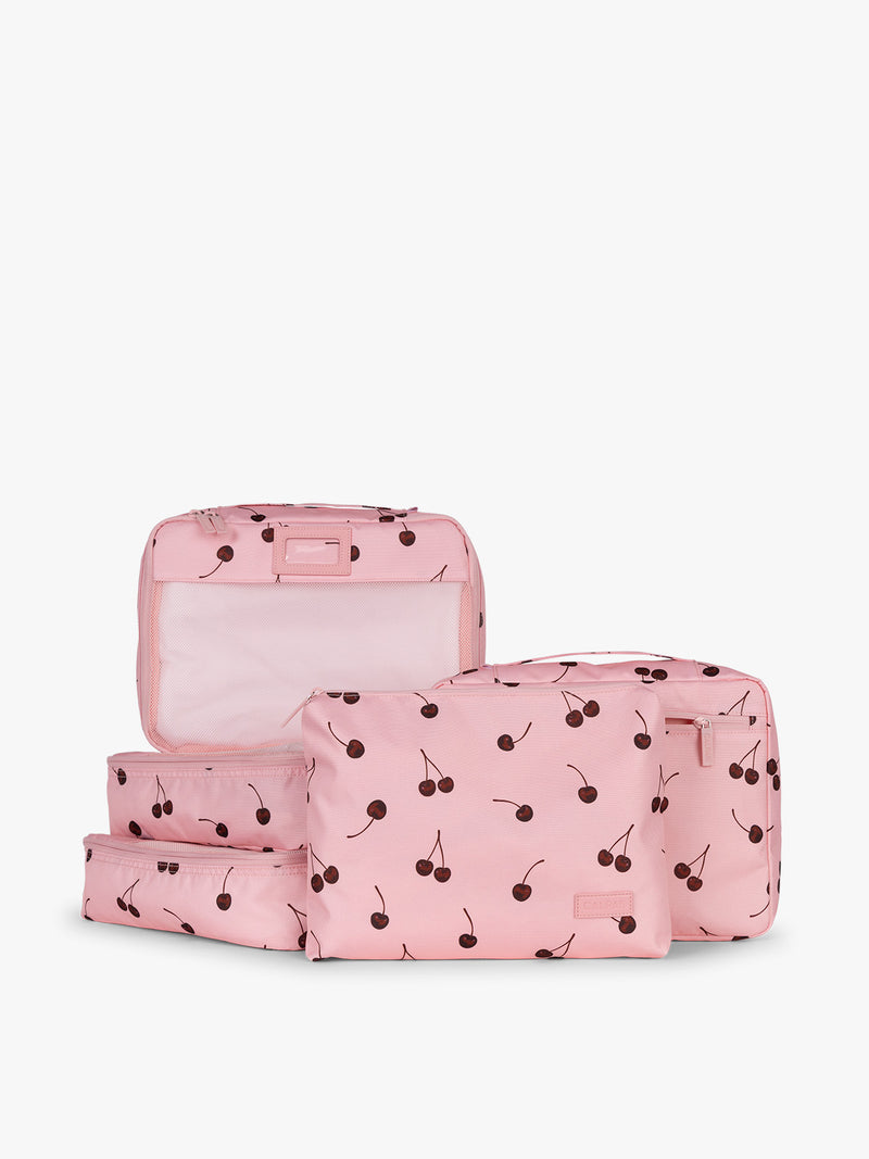CALPAK Packing Cubes 5pc Set in pink with cherry print in Blossom Cherry on a white background