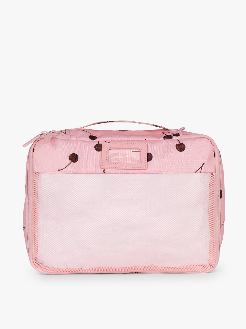 Front view of CALPAK Packing Cubes 5pc Set in pink with cherry print in Blossom Cherry on a white background