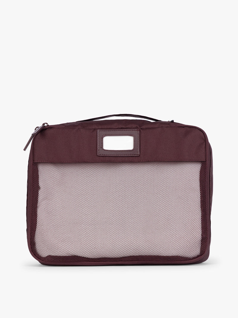 Burgundy Dark Cherry CALPAK 5-piece travel packing cubes set with close up of mesh cubes with a label, displayed on a clean white background