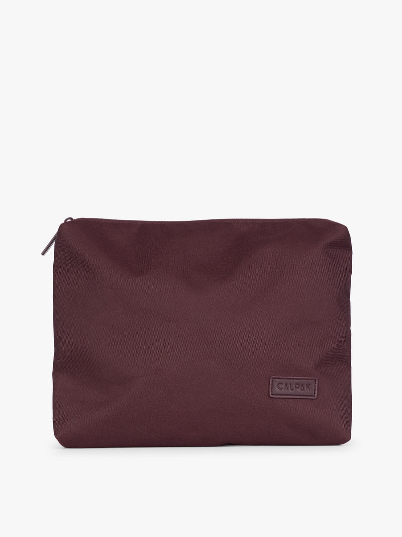 Burgundy Dark Cherry CALPAK 5-piece travel packing cubes set with close up of packing cube envelope design with top zipper, displayed on a clean white background