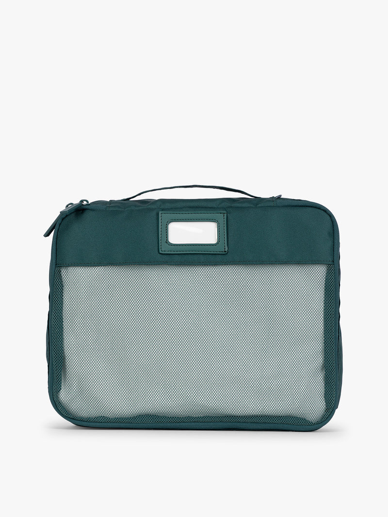 Deep green teal Kale CALPAK 5-piece travel packing cubes set with close up of mesh cubes with a label, displayed on a clean white background