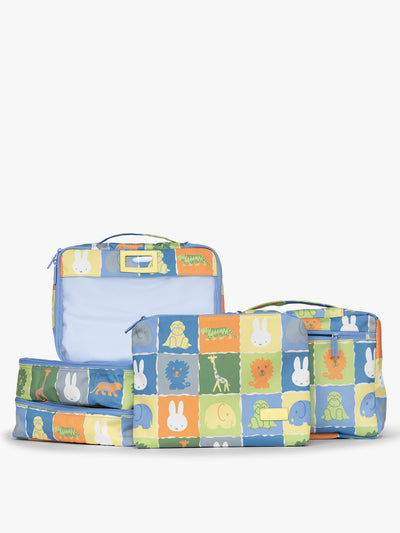 Set of CALPAK Packing Cubes in colorful blue pouches with Miffy and animal pattern on a white background; PC1601-MIFFY-BLUE-ZOO-TRIP view 1