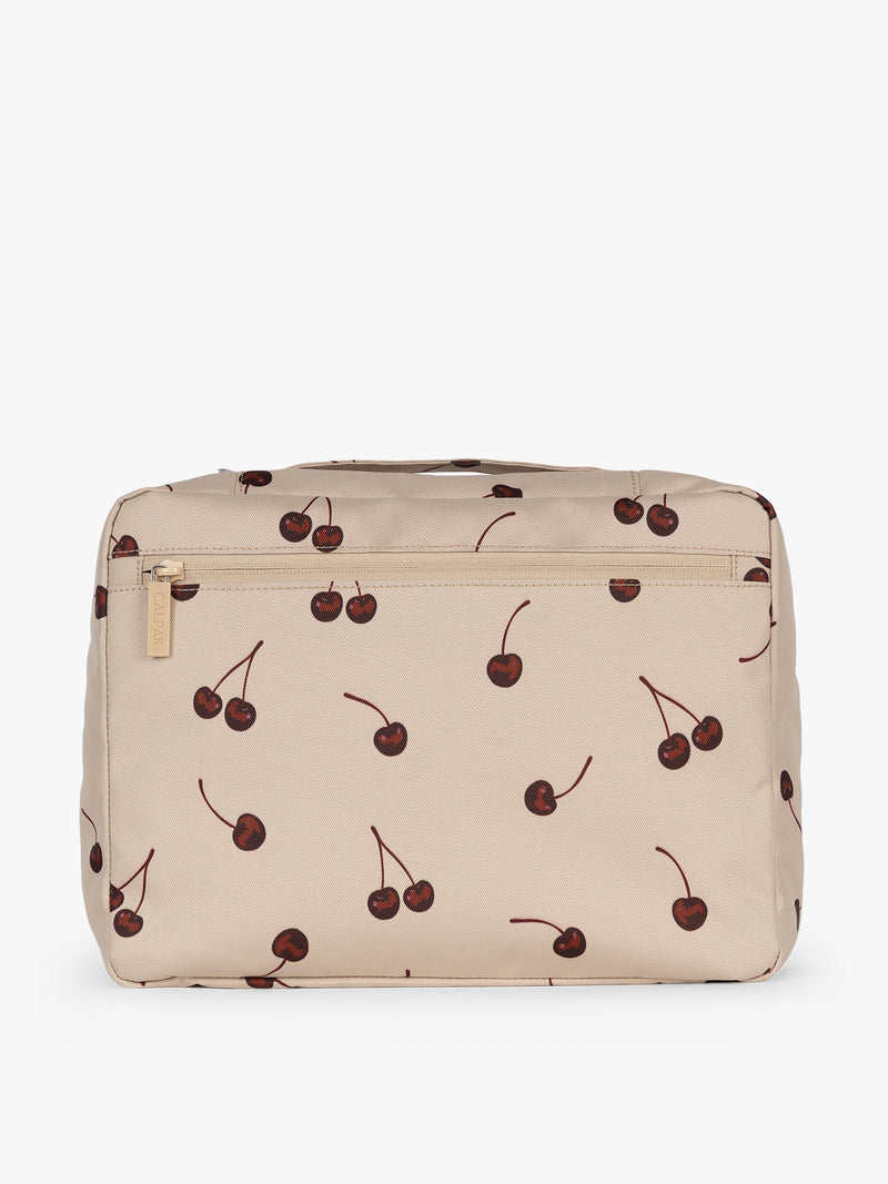 Back view of CALPAK Packing Cubes 5pc Set in beige with cherry print in Oatmeal Cherry on a white background