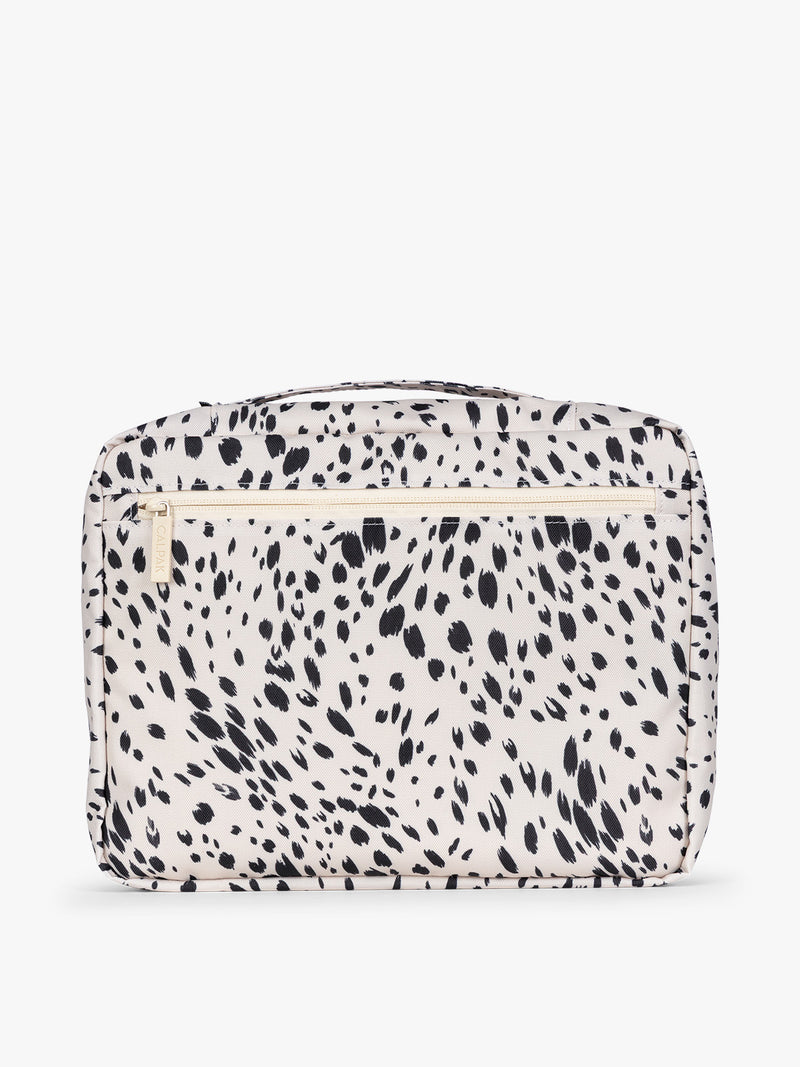 White and black animal print Snow Leopard CALPAK 5-piece travel packing cubes set with close up of packing cube with a zipper, displayed on a clean white background