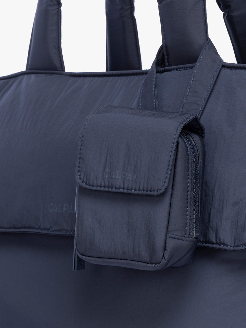 CALPAK Pacifier Pouch in blue Navy on a bag