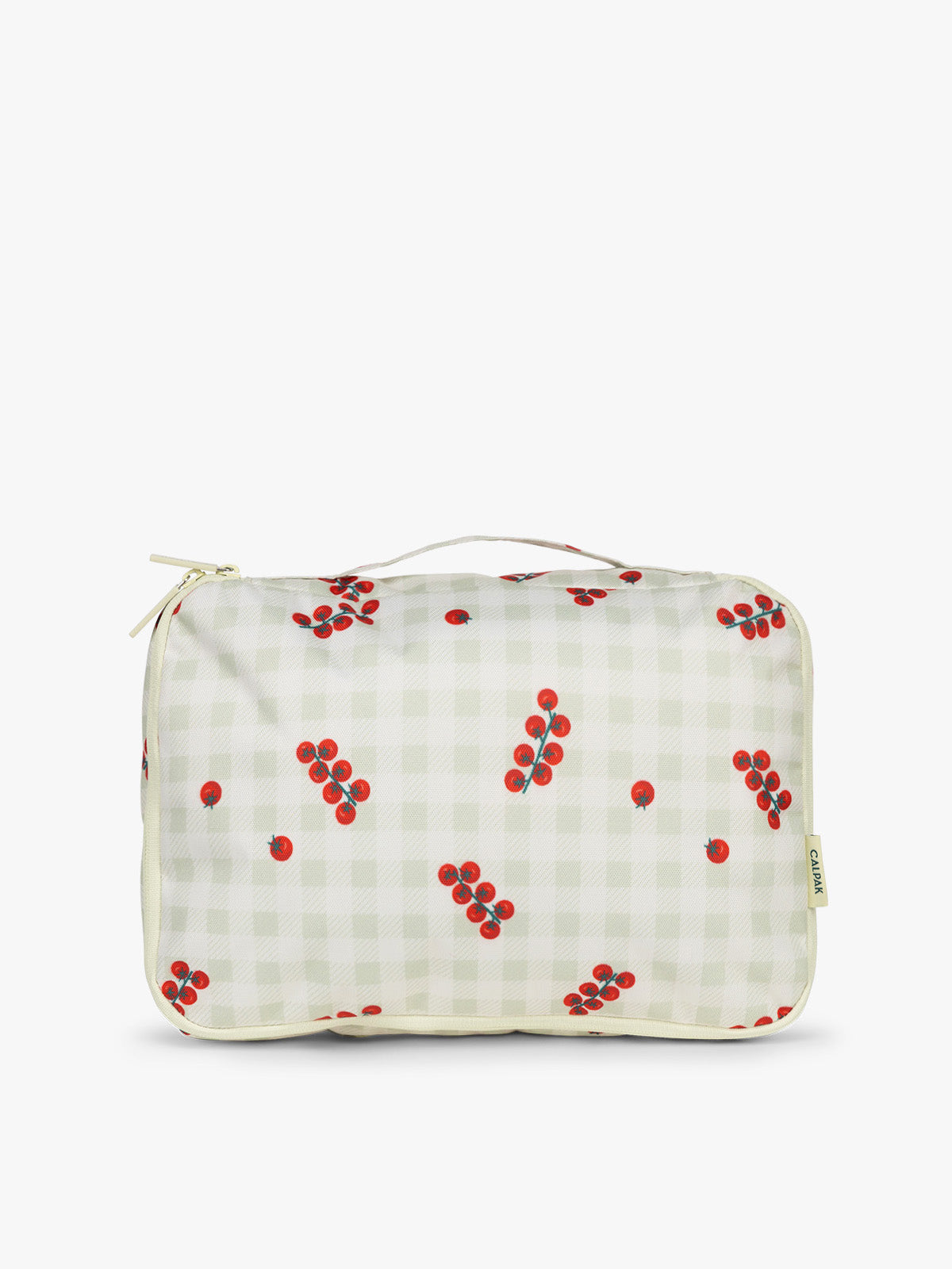 One of CALPAK Medium Compression Packing Cubes in white and green gingham pattern with tomato print; PCC2201-CELADON-TOMATO-PICNIC