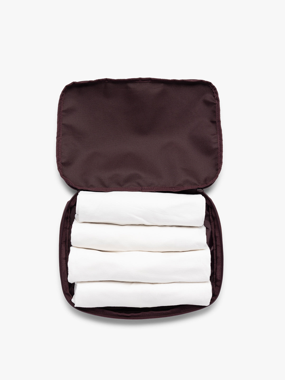 Opened view with clothing in the burgundy Dark Cherry CALPAK Medium Compression Packing Cubes with zippers shown on a clean white background; PCC2201-DARK-CHERRY