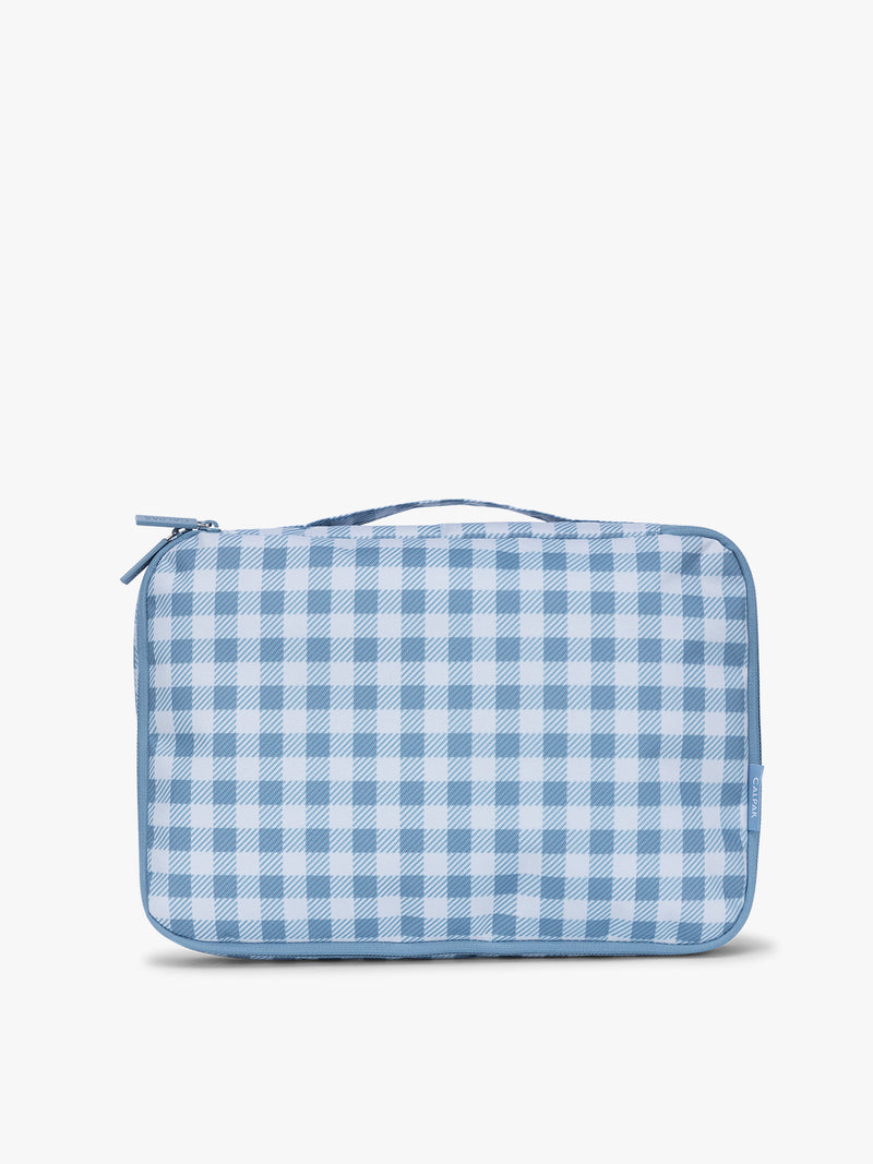 Front view of CALPAK Medium Compression Packing Cubes (Set of 2) in white and blue gingham print in French Blue Gingham