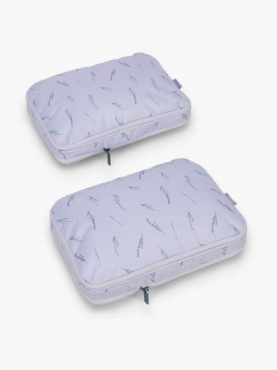 CALPAK Medium Compression Packing Cubes (Set of 2) compressed in light purple with lavender print in Lavender Bloom; PCC2201-LAVENDER-BLOOM view 1