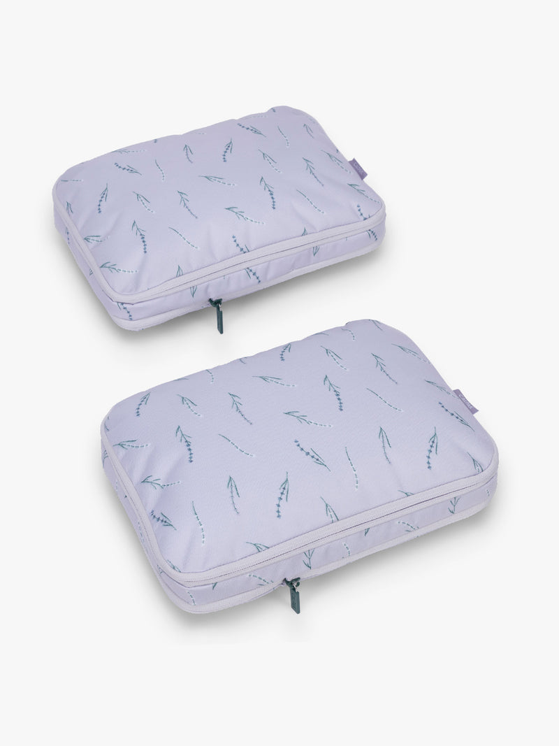 CALPAK Medium Compression Packing Cubes (Set of 2) compressed in light purple with lavender print in Lavender Bloom